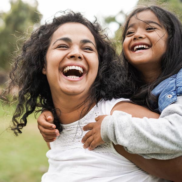 mother and daughter laughing