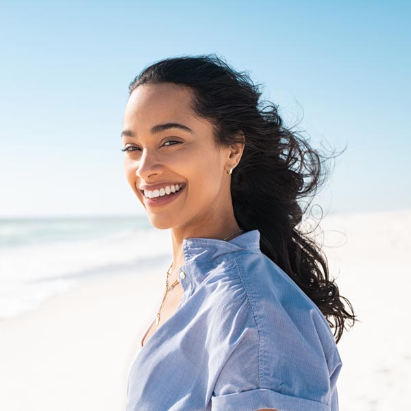 smiling young woman on beach