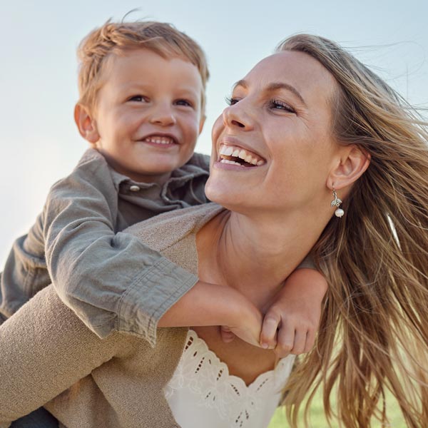 mother and young son smiling